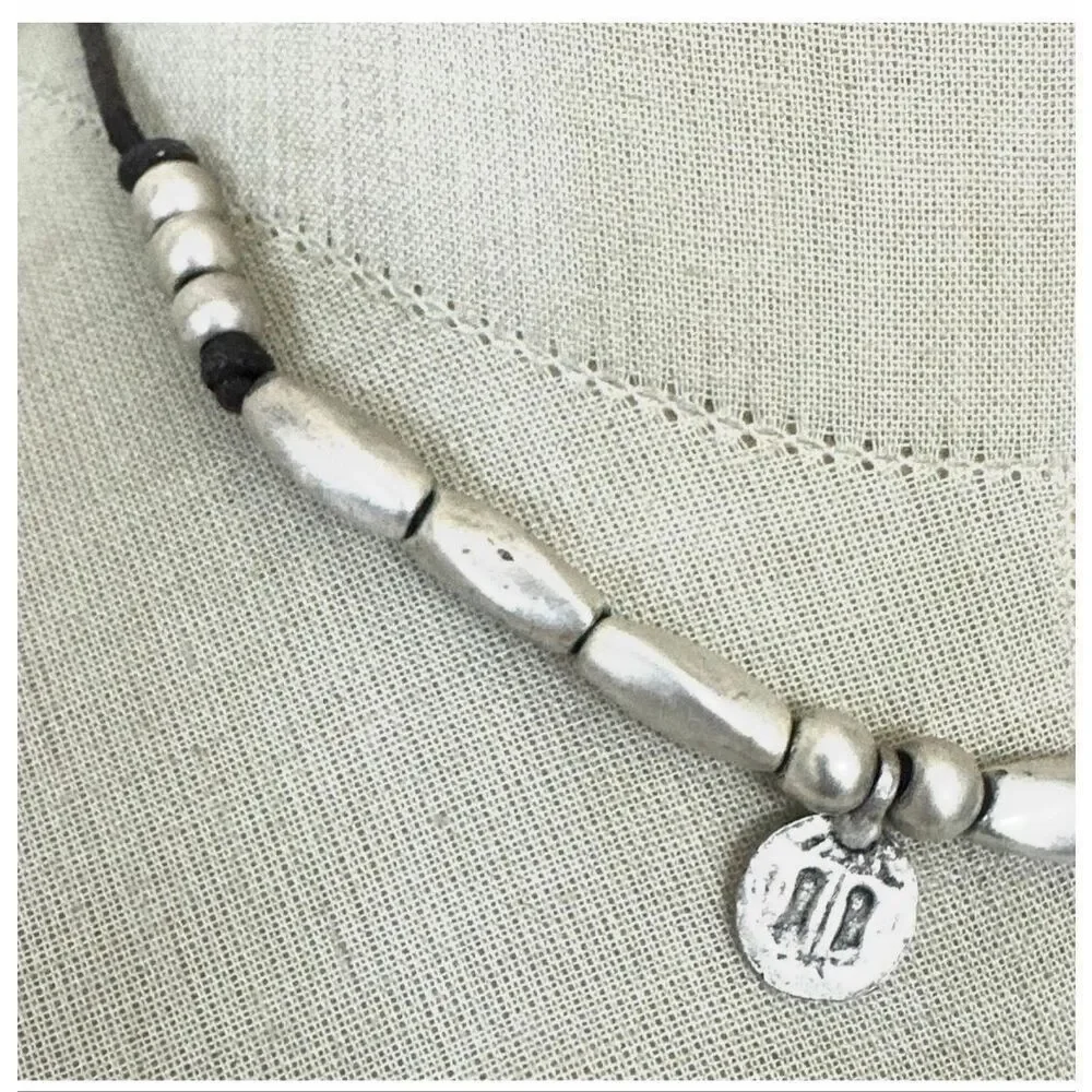 Silver Tone Beaded Leather Necklace with Textured Disc Charms